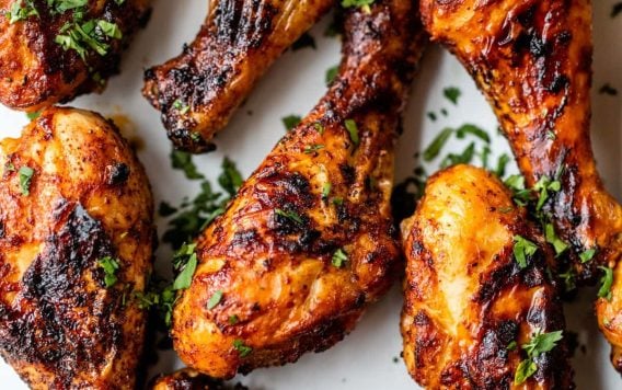 Flavorful air fryer chicken legs on a plate