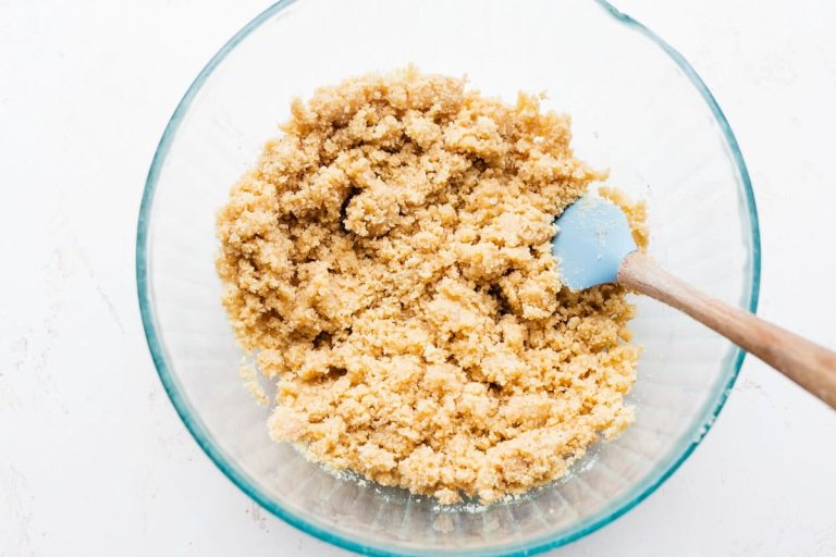 Ingredients for a crust being stirred in a bowl