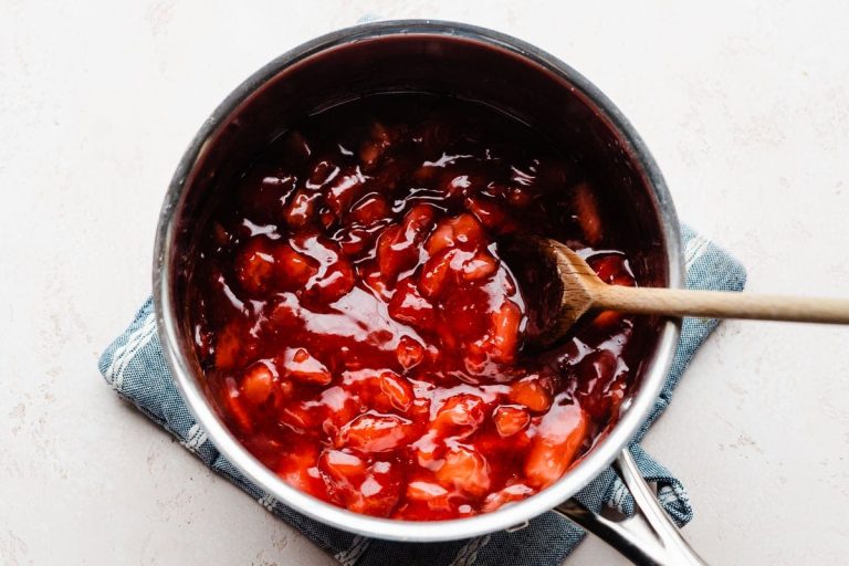 Strawberries being stirred in a pot