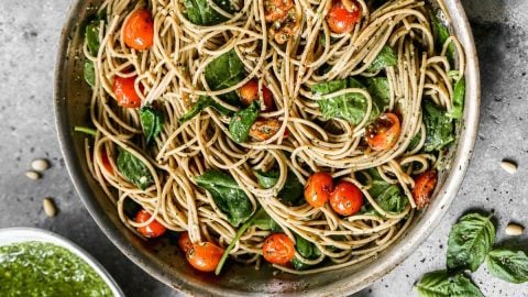 A pot with noodles and vegetables
