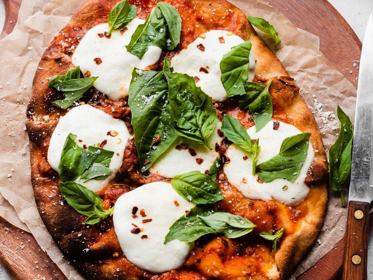 Easy naan pizza on a wooden board