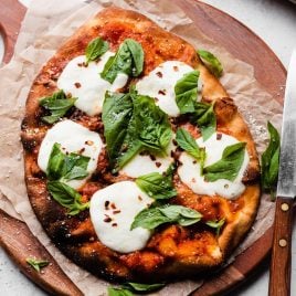 Easy naan pizza on a wooden board