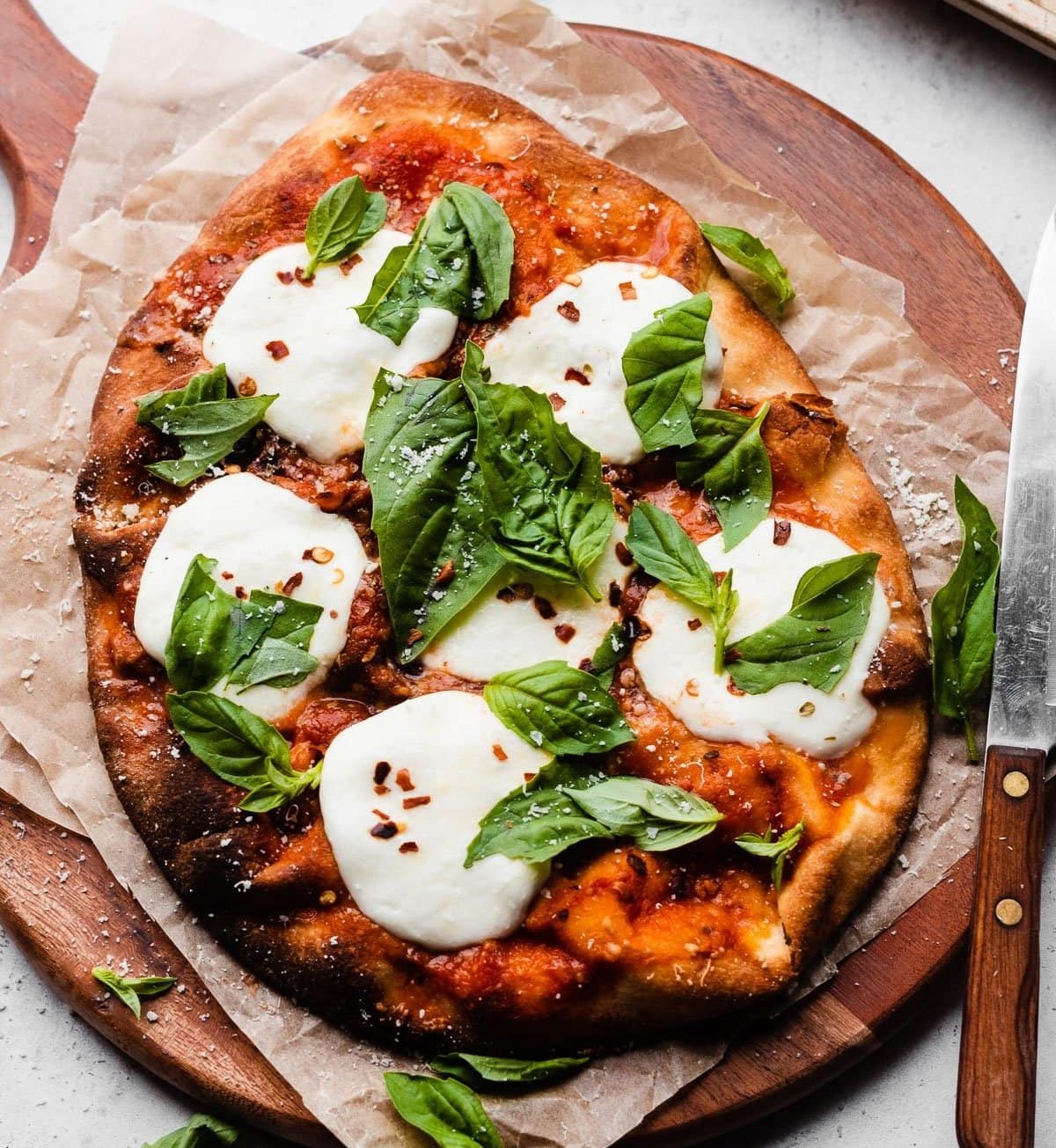 Easy naan pizza on a wooden board