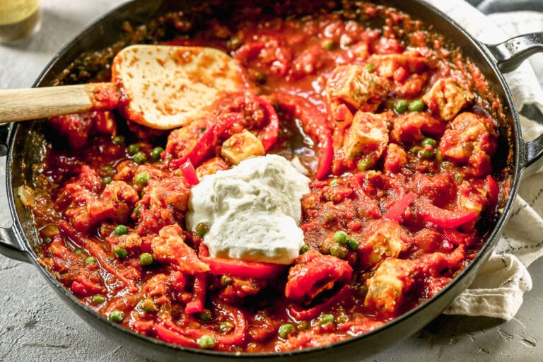 a skillet of greek yogurt with paneer tikka masala without cream