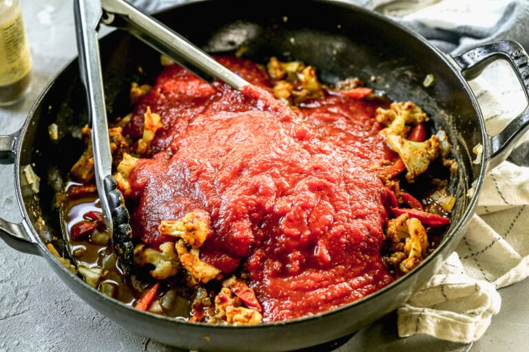 paneer tikka masala with fire roasted tomatoes in a skillet