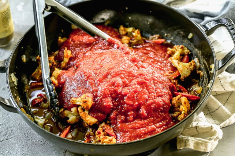 paneer tikka masala with fire roasted tomatoes in a skillet