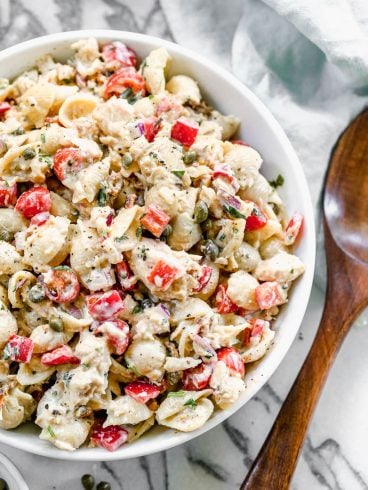 A white bowl of tuna pasta salad
