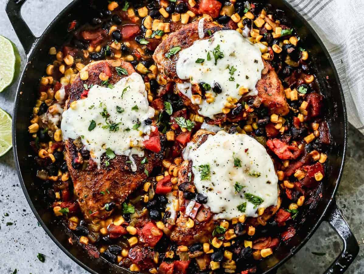 A cast iron skillet with cowboy chicken