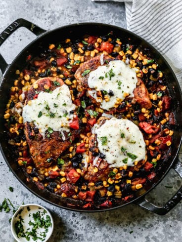 A cast iron skillet with cowboy chicken