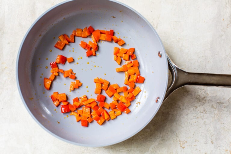 chopped bell peppers in a wok
