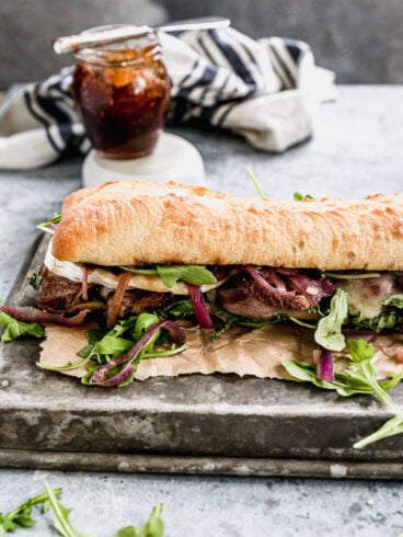 gourmet steak sandwich on ciabatta with red onions