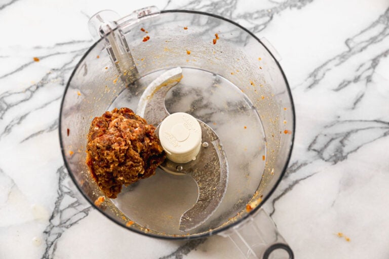 a ball of sticky dates pulsed in a food processor