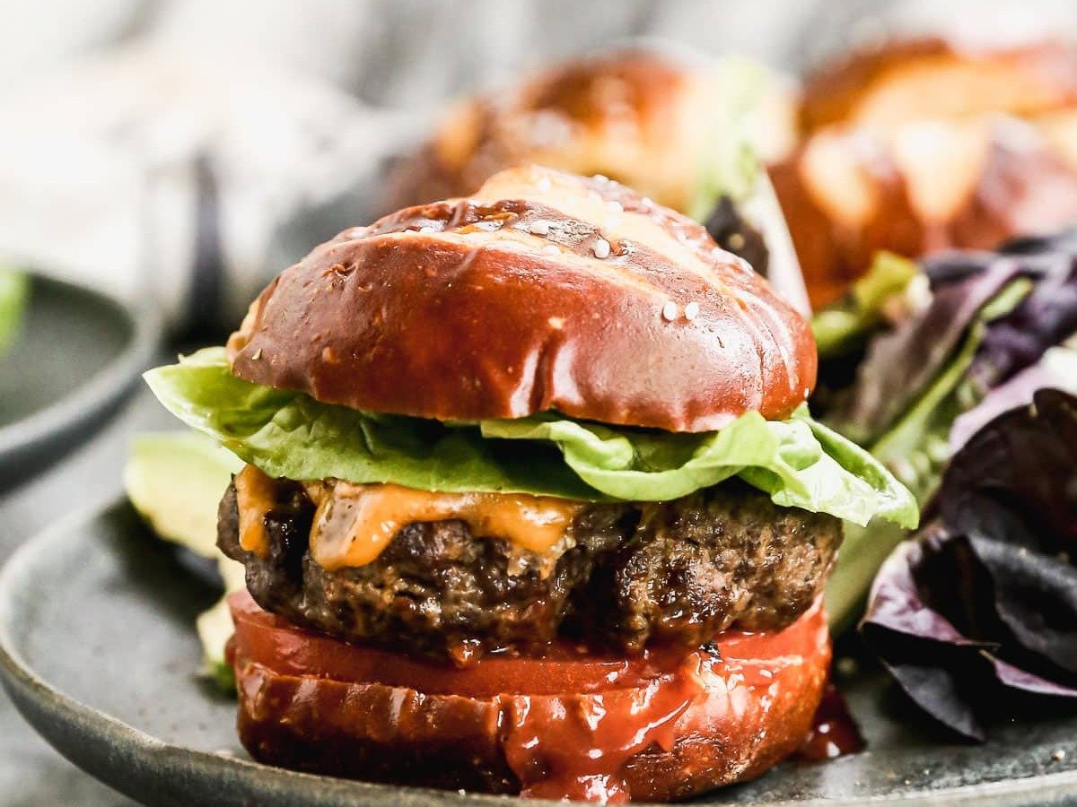 Air Fryer Hamburger with Cheese and Toppings on a Bun