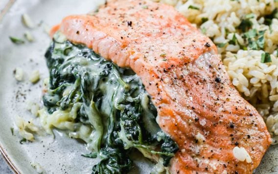 Stuffed salmon with spinach and cream cheese on plate