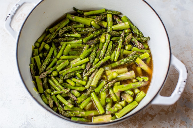 tender fresh asparagus in a Dutch oven for soup