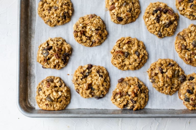 baked oatmeal cookies on baking sheet lined with parchment paper