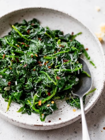 sauteed spinach topped with spices and parmesan