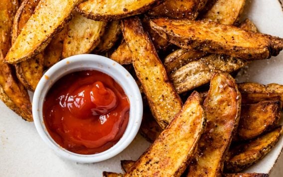 quick air fryer potato wedges on a plate
