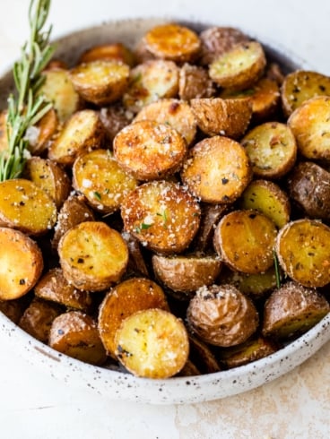 a bowl of crispy red potatoes seasoned