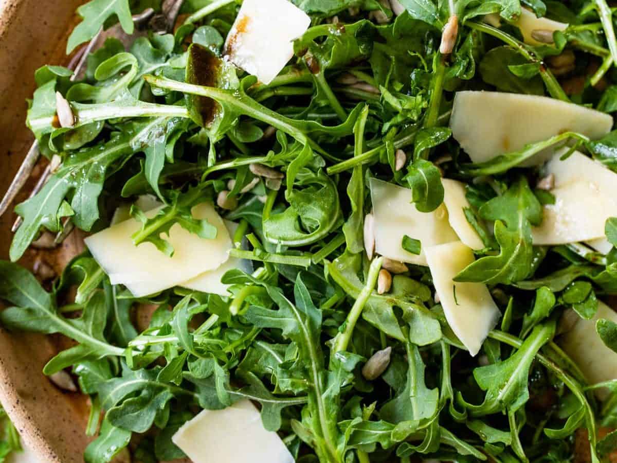 the best arugula salad recipe in a bowl