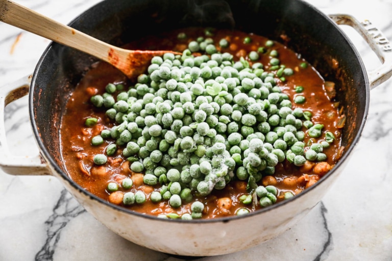 frozen peas for chickpea curry in a large pot