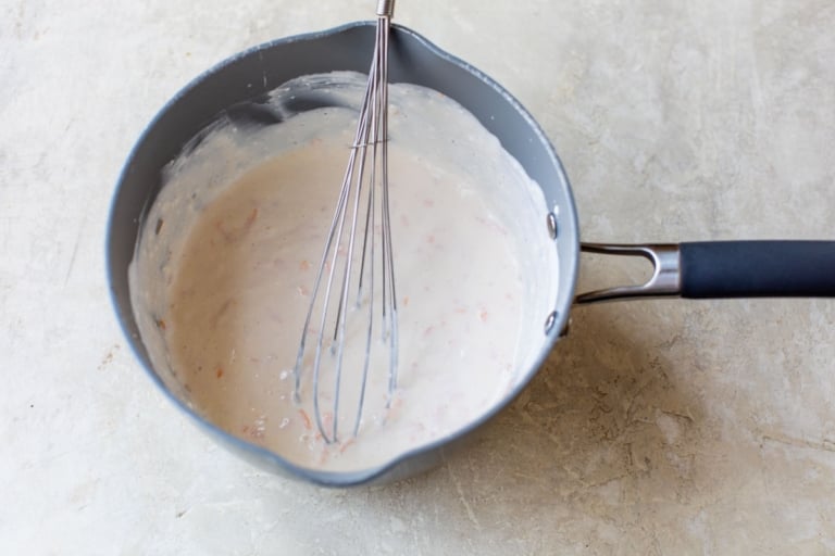 whisking together sauce for ground beef casserole