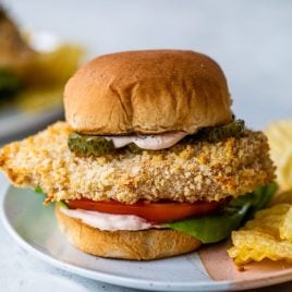 spicy chicken sandwich with spicy sauce on a plate