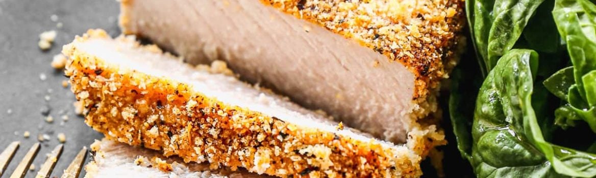 the best breaded pork chops recipe on a plate cut