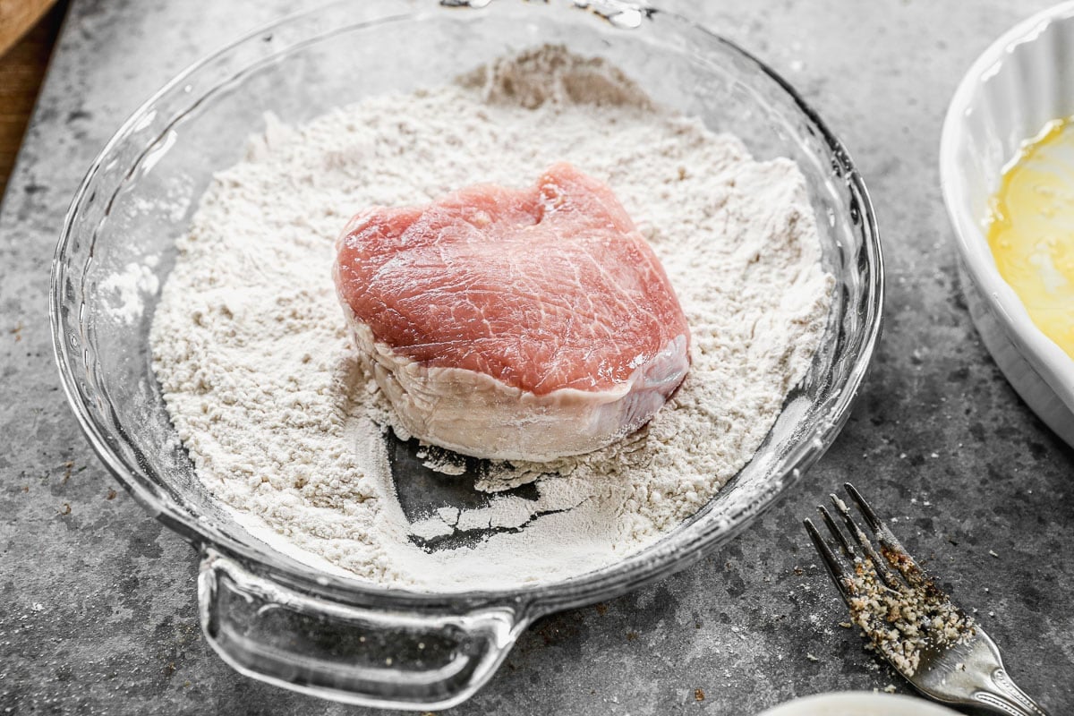 dredging pork chops in flour
