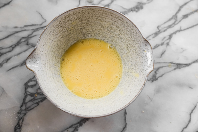 eggs in a bowl to make a perfect french omelette