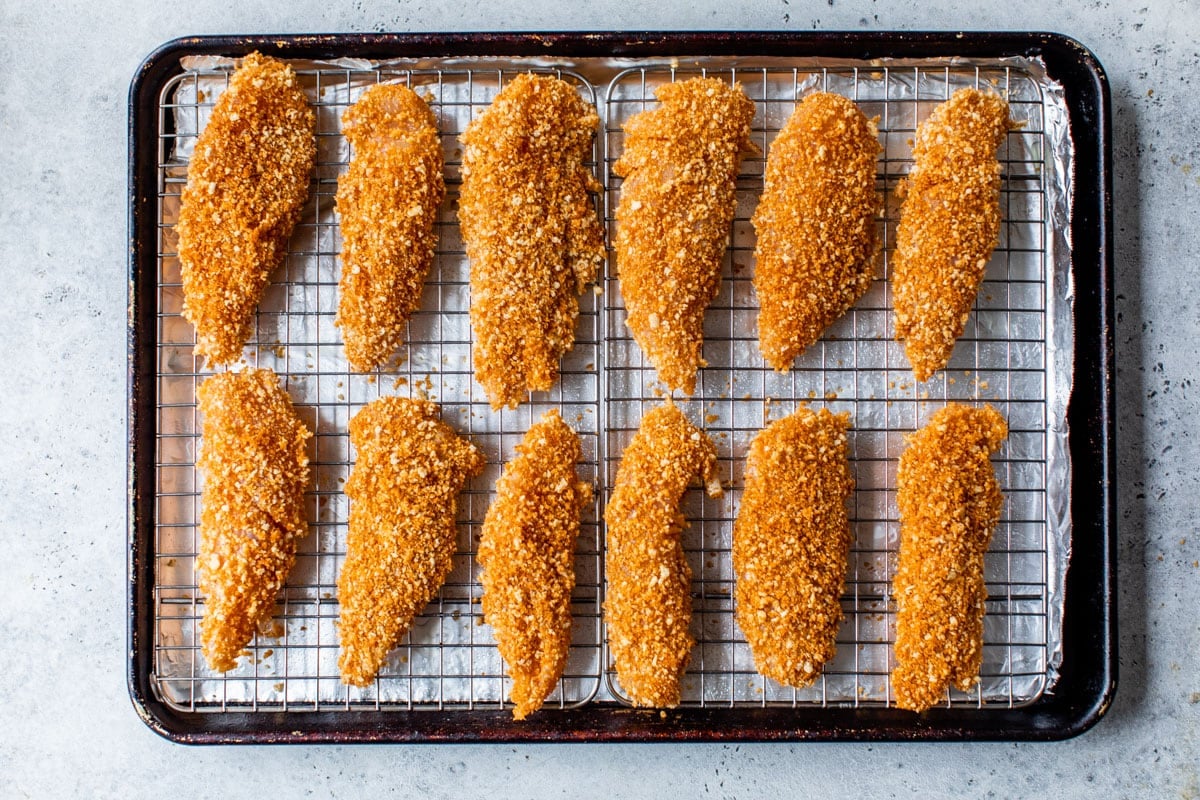 breaded chicken tenders recipe on a baking sheet