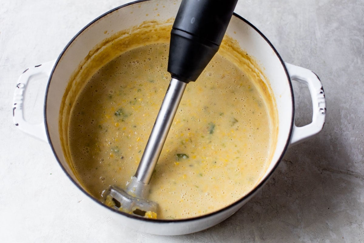 immersion blender making creamy corn chowder recipe