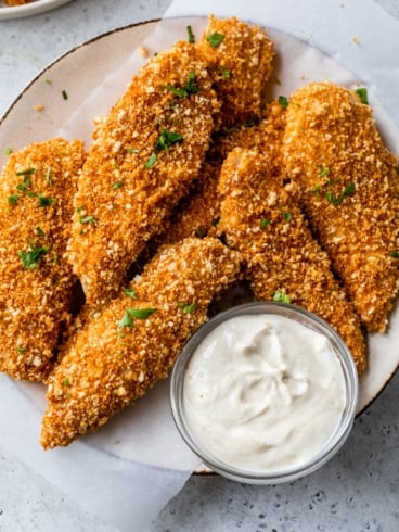 a plate of breaded chicken tenders