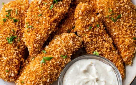 a plate of breaded chicken tenders