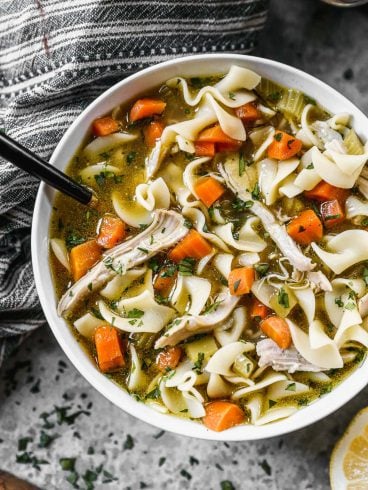 bowl of chicken noodle soup with egg noodles