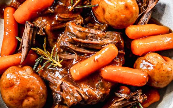instant pot roast with carrots and potatoes on a plate