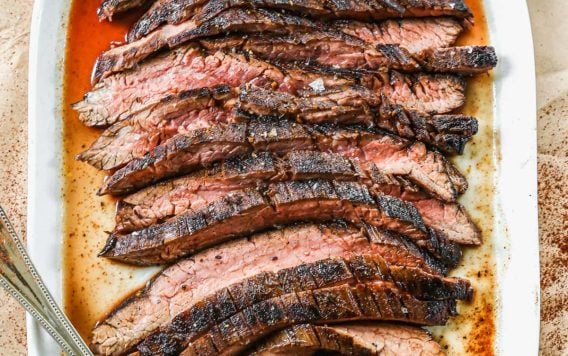 a plate of juicy grilled flank steak