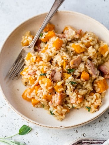 a plate of risotto with roasted butternut squash