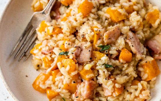a plate of risotto with roasted butternut squash