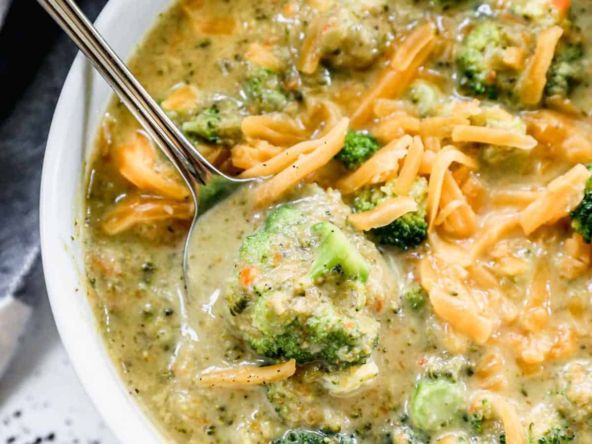 best broccoli and cheddar soup in a bowl topped with cheddar cheese