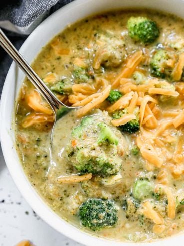 best broccoli and cheddar soup in a bowl topped with cheddar cheese
