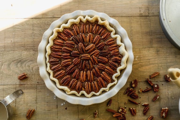 whole chocolate pecan pie with pecan halves on top