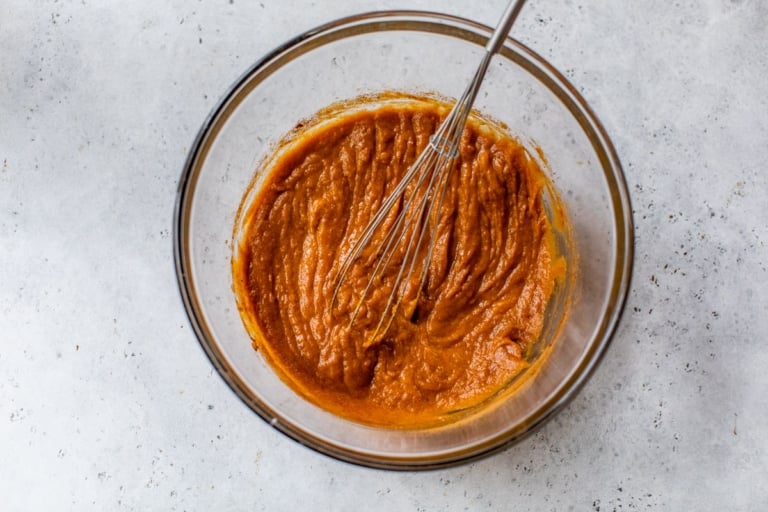a large mixing bowl of pumpkin pie filling for pie without a crust