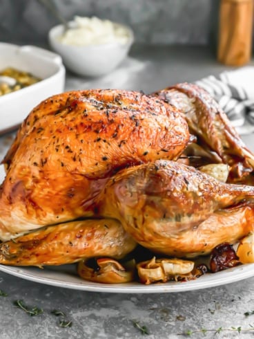 juicy roasted thanksgiving turkey on a platter for thanksgiving