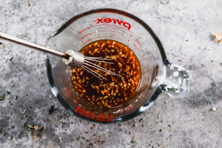 whisking sauce for healthy stir fry with chicken and broccoli