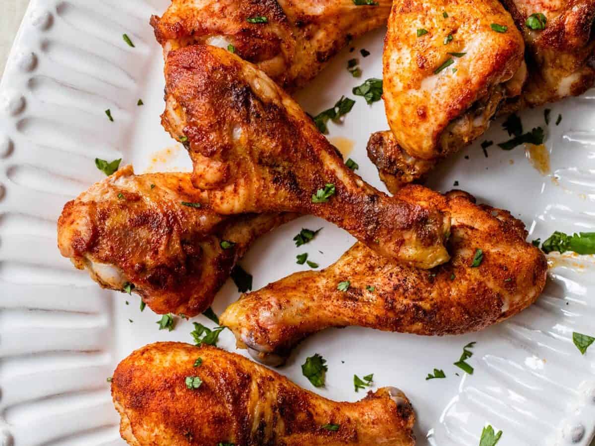crispy baked chicken legs on a serving platter