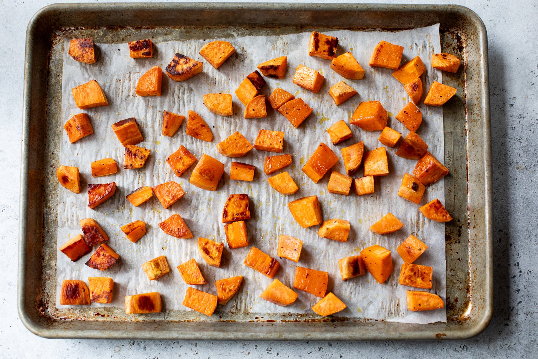 Roasted sweet potatoes on sheet pan