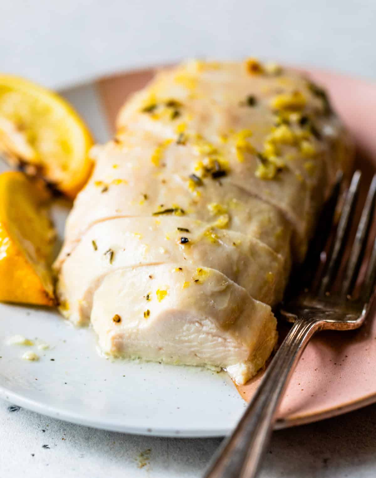 juicy baked lemon chicken on plate