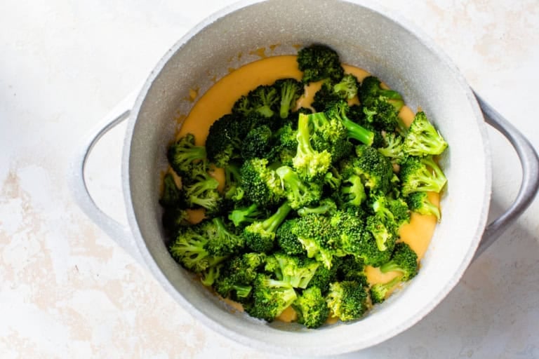 Broccoli added to cheese sauce