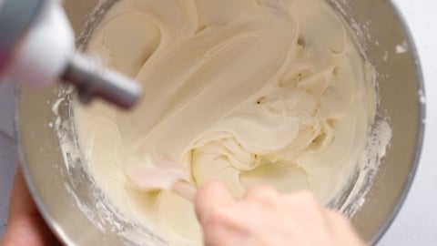 Cream cheese frosting in mixing bowl